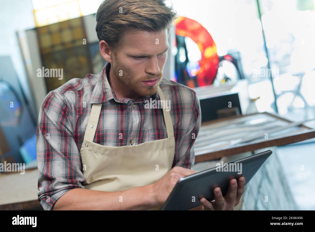 male worker using tablet in the workshop Stock Photo