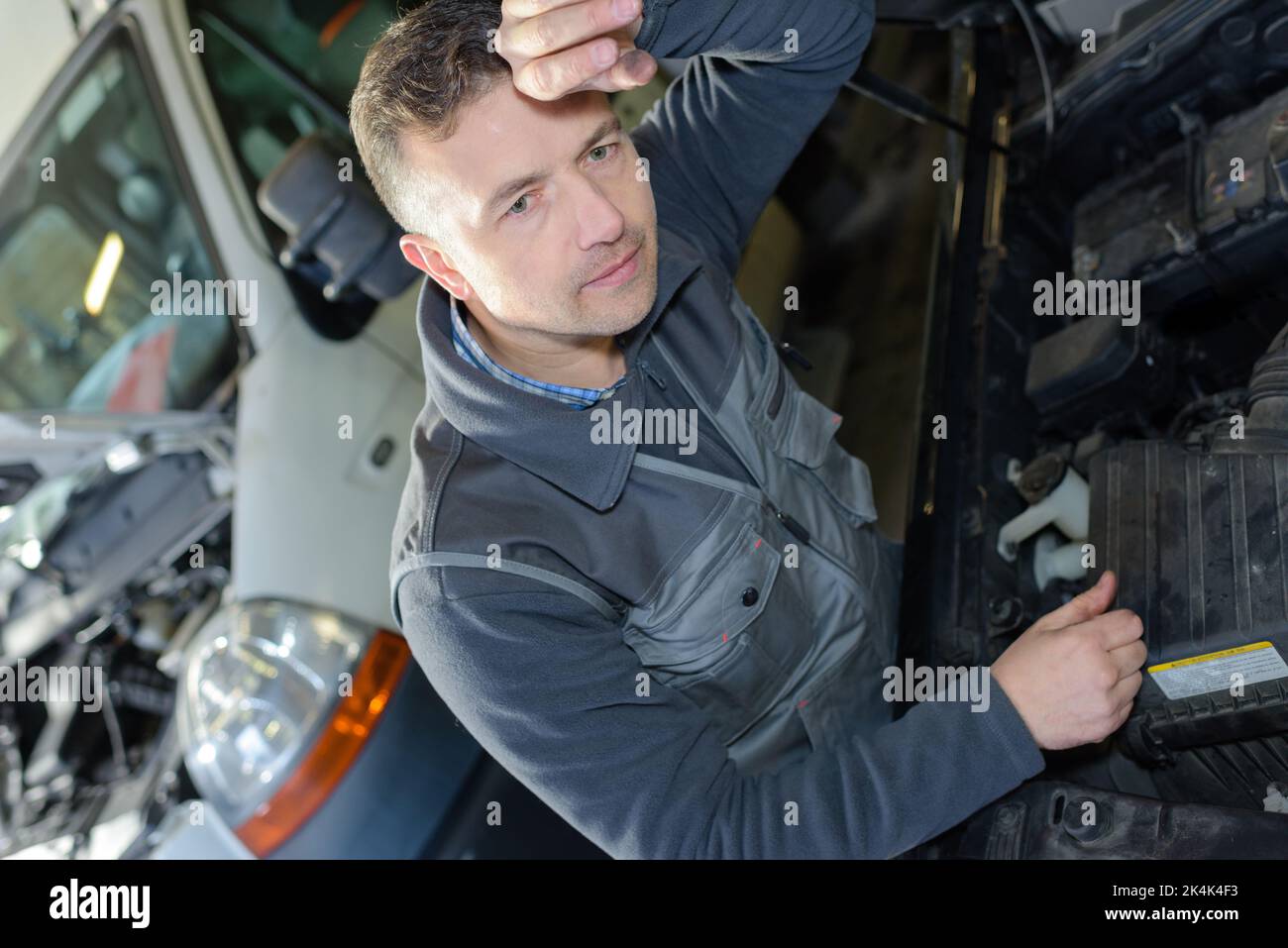 portrait of male mechanic at work in the garage Stock Photo