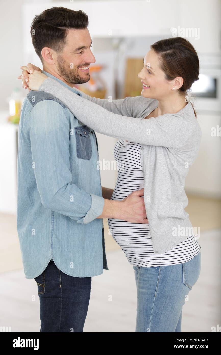 man and pregnant woman dance indoors Stock Photo - Alamy