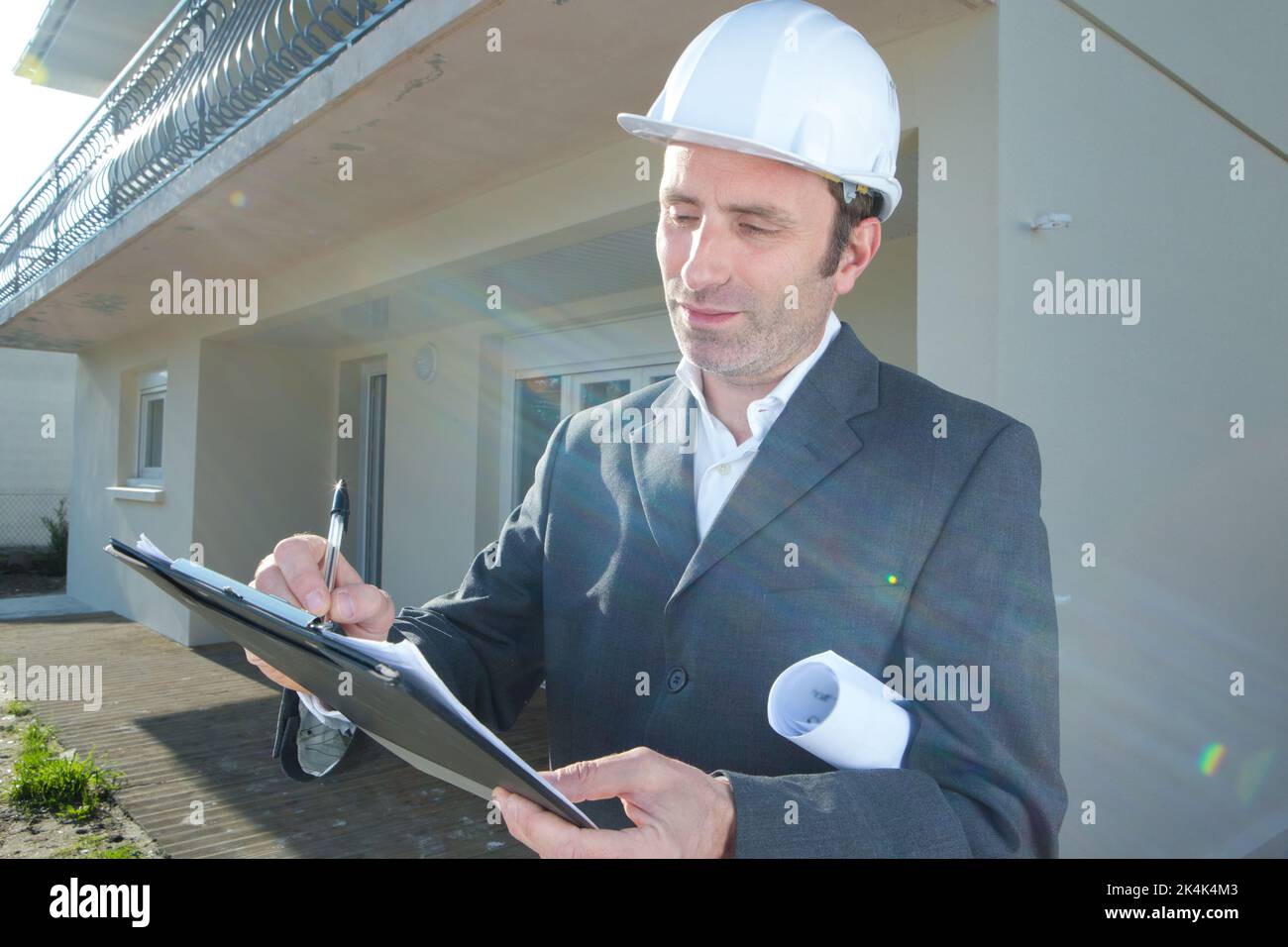 man architect in helmet working outdoors Stock Photo