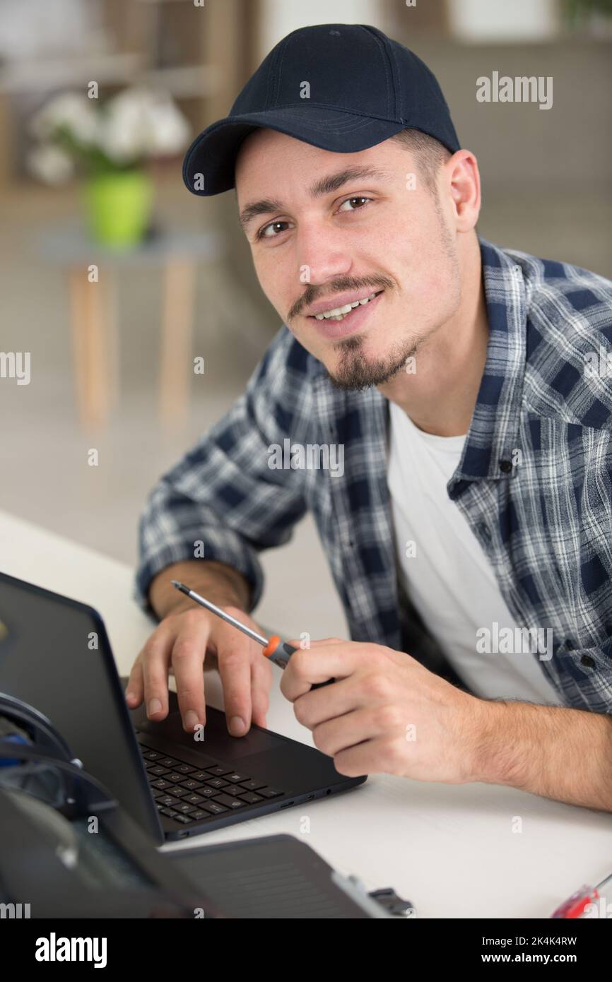 hardware repairman repairing broken printer fax machine Stock Photo Alamy