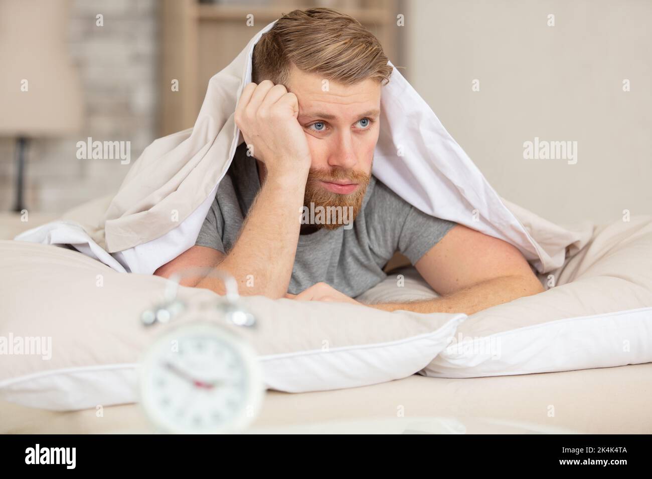 young handsome man having trouble sleeping Stock Photo