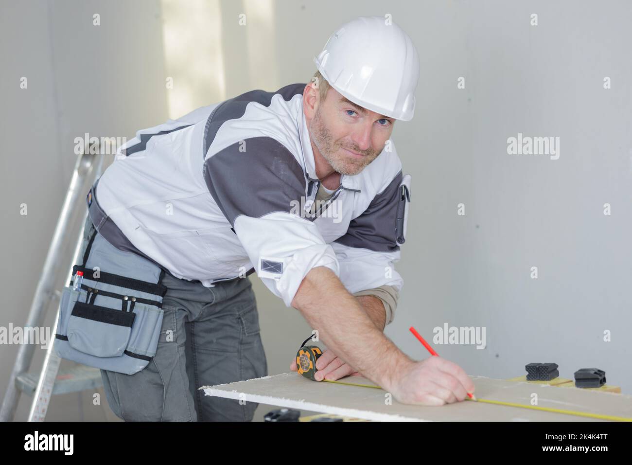 man carpenter working on a projet Stock Photo