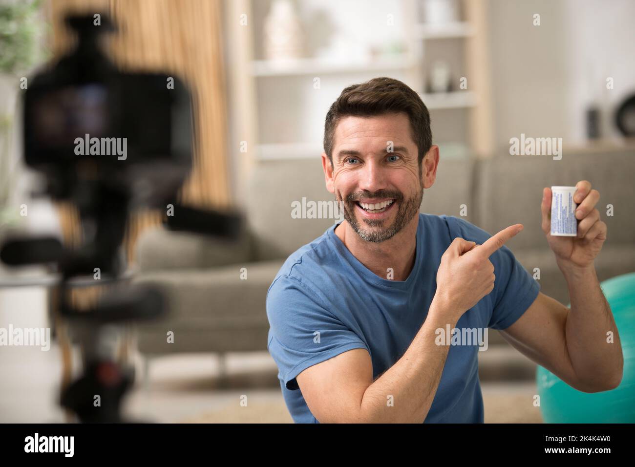 a male sport blogger recording video at home Stock Photo