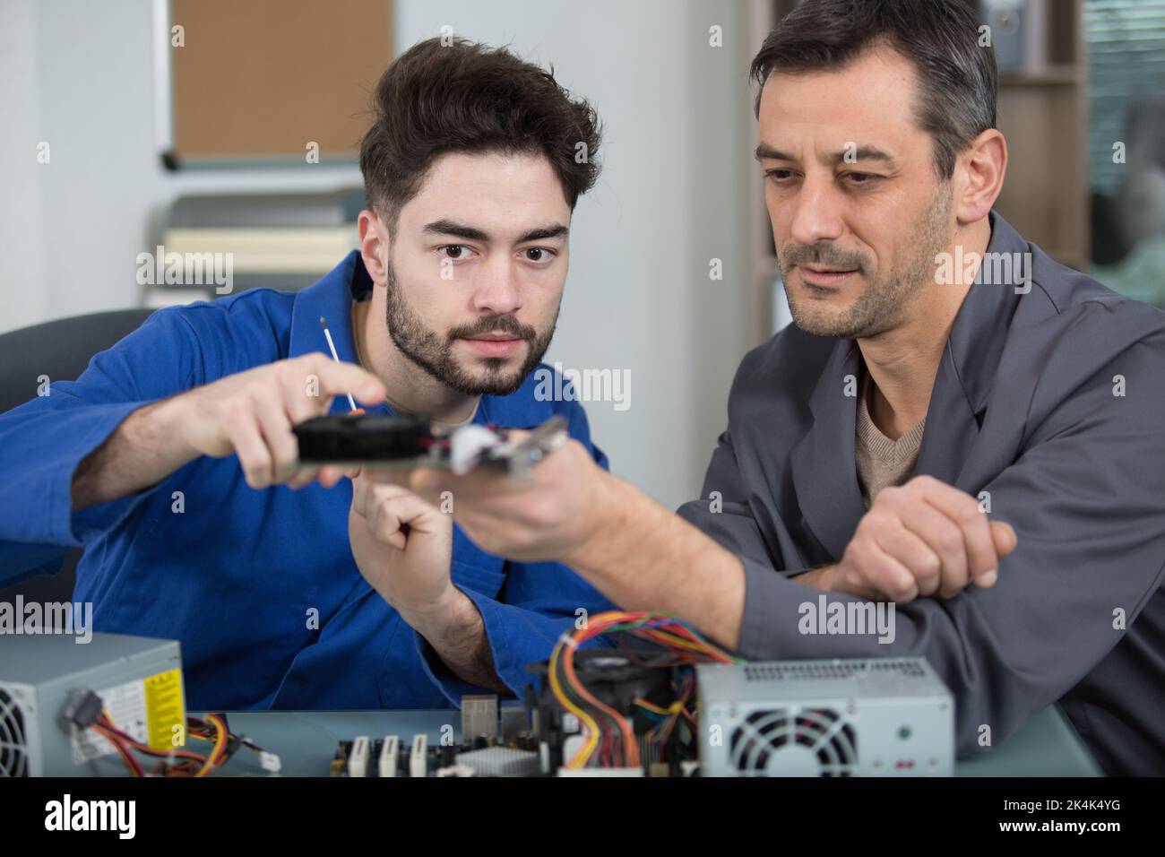 computer technician learning with his supervisor Stock Photo