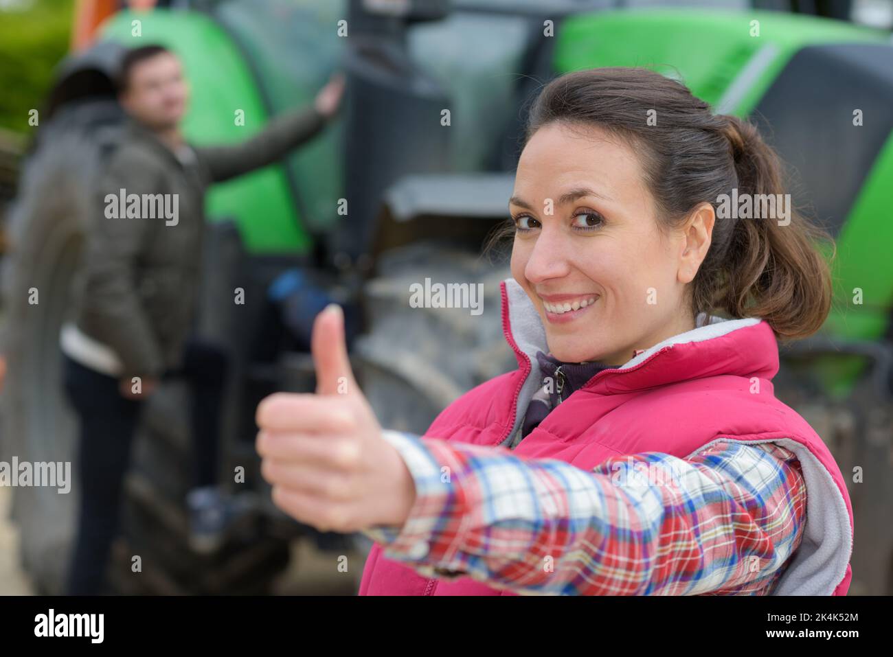portrait of pretty and happy farmer thumb-up Stock Photo