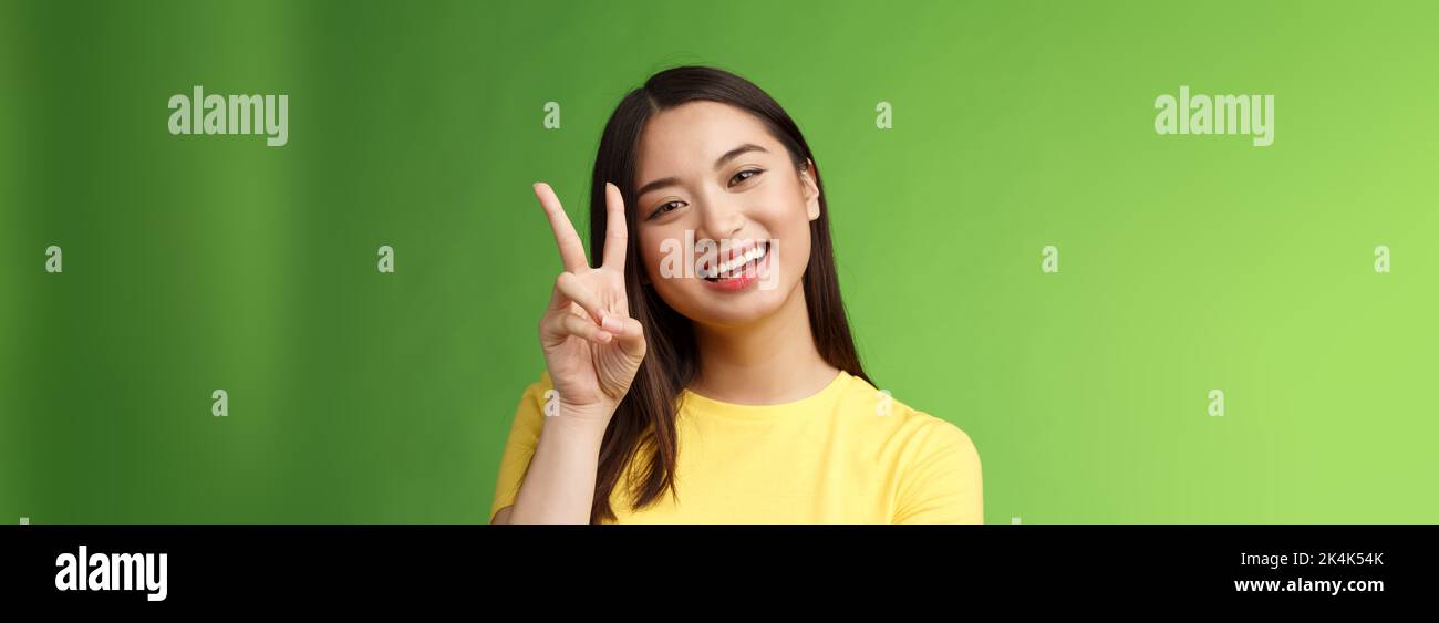 Close Up Joyful Cute Asian Girl Lively Look Camera Smile Show Peace Victory Sign Entertained