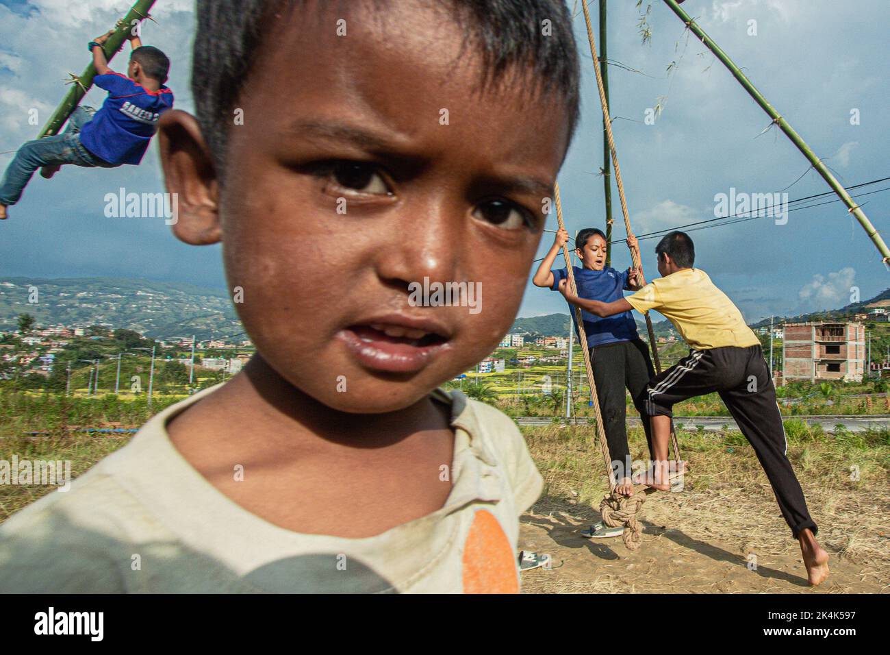 Nepal. 3rd Oct, 2022. Young boys and girls play traditional swing in