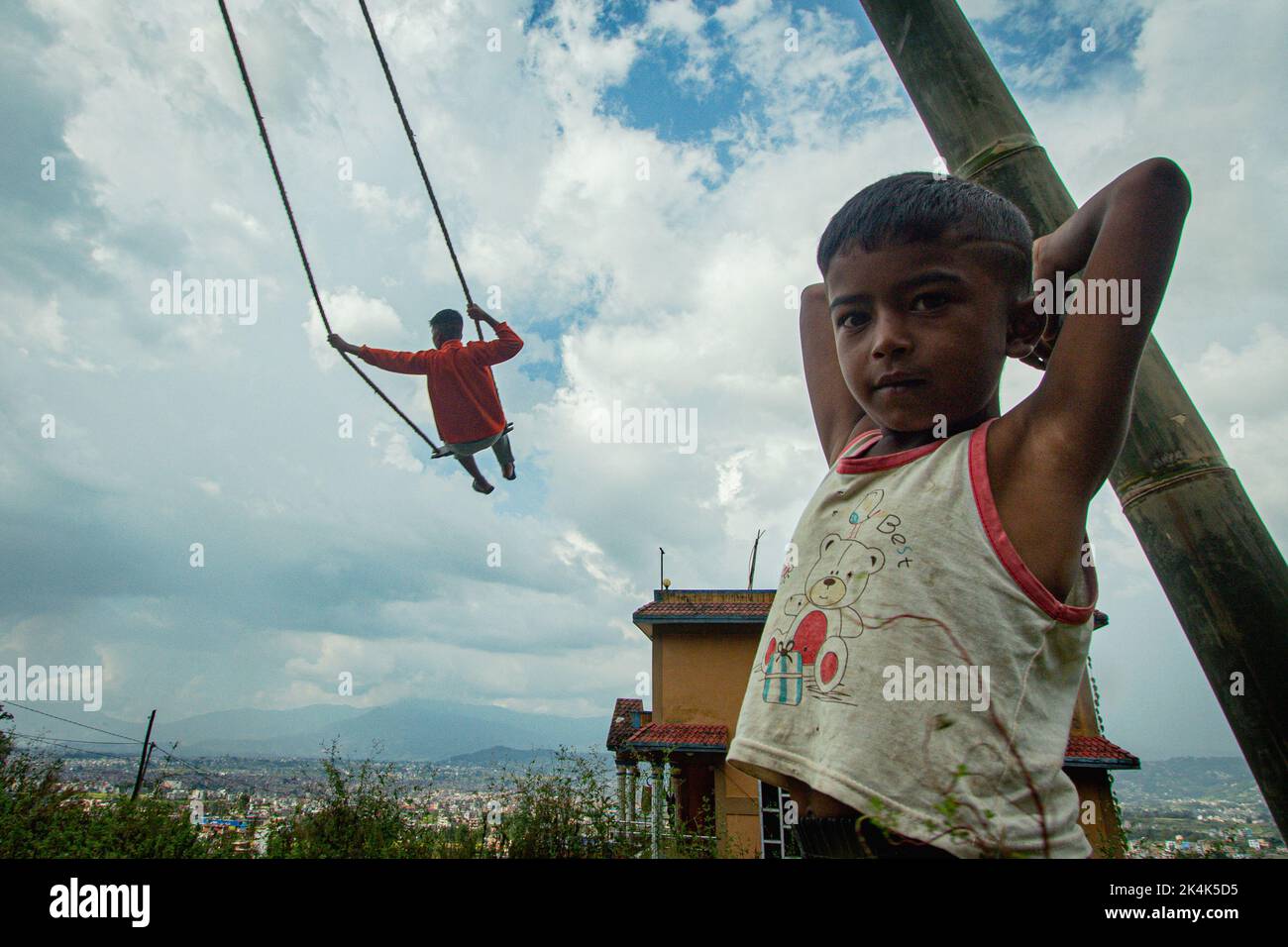 Nepal. 3rd Oct, 2022. Young boys and girls play traditional swing in