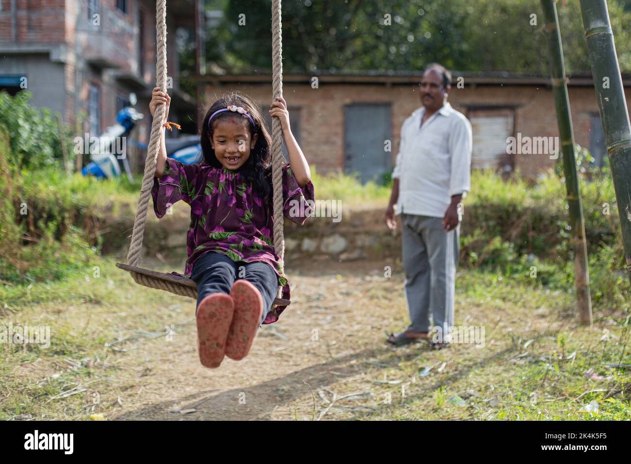 Nepal. 3rd Oct, 2022. A girl play traditional swing in Sipadol