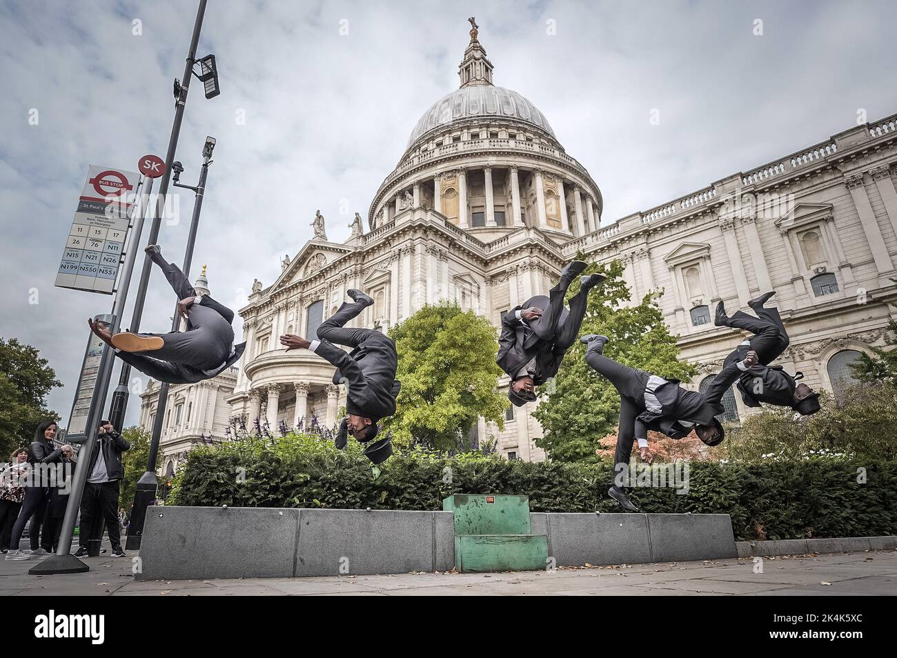 London, UK. 3rd October, 2022. The Black Blues Brothers perform acrobats near St Paul's Cathedral ahead of their autumn UK tour. This troupe of professional acrobats from Kenya are a tribute act to the cult movie The Blues Brothers. Credit: Guy Corbishley/Alamy Live News Stock Photo