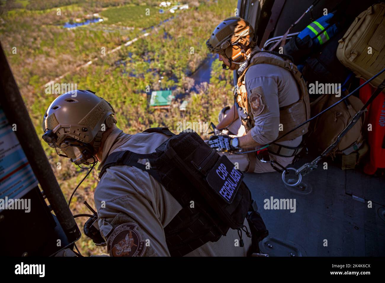 NEAR FORT MYERS, FLORIDA, USA - 30 September 2022 - US Customs and Border Protection pararescuemen look for survivors in the aftermath along Florida's Stock Photo