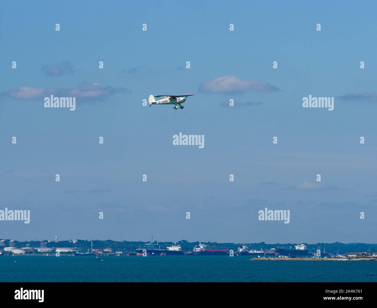 Light aircraft flying over the Solent towards Solent Airport Daedalus, Lee-on-the-Solent, Hampshire, UK Stock Photo