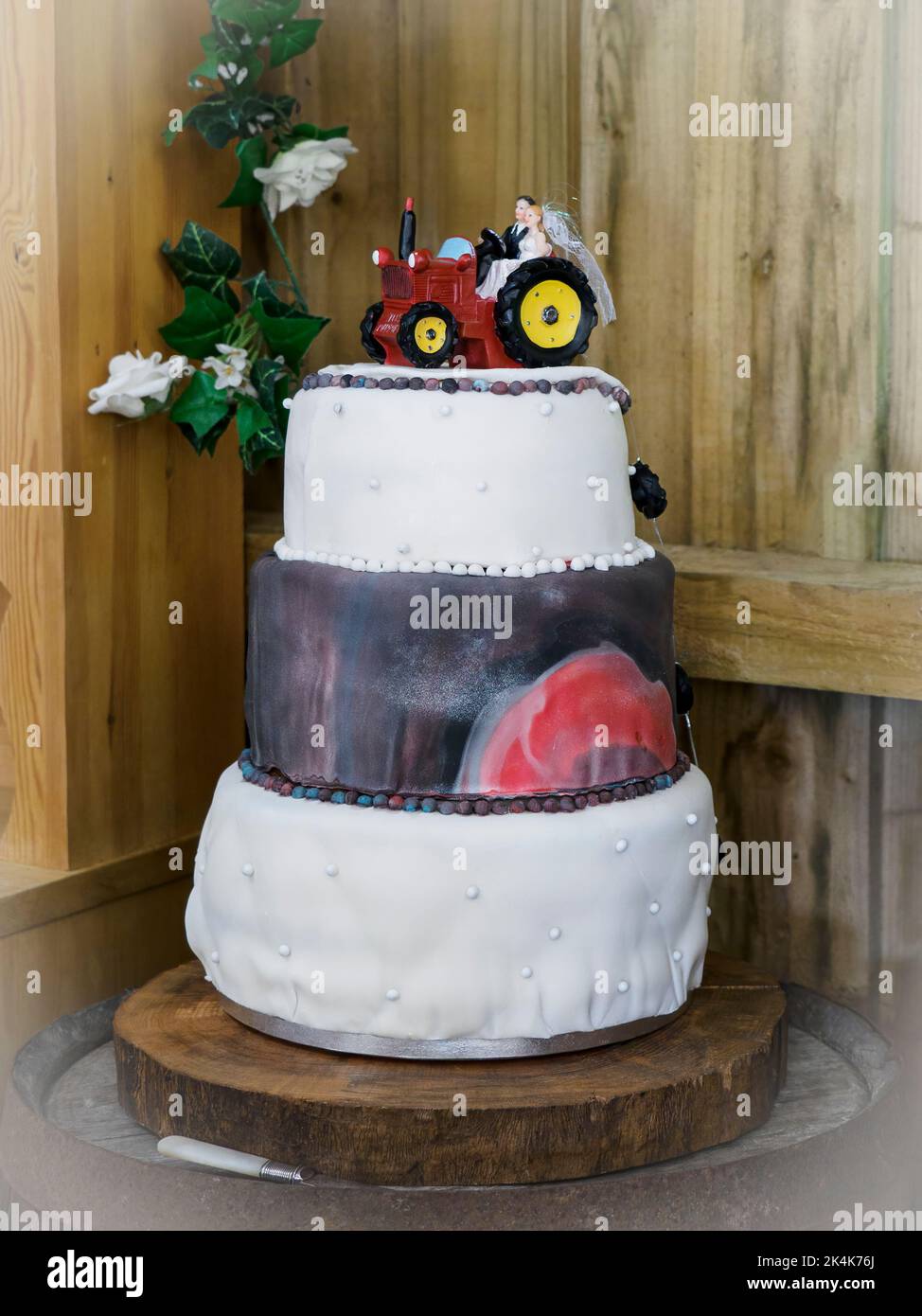 Wedding cake with a tractor on top, UK Stock Photo