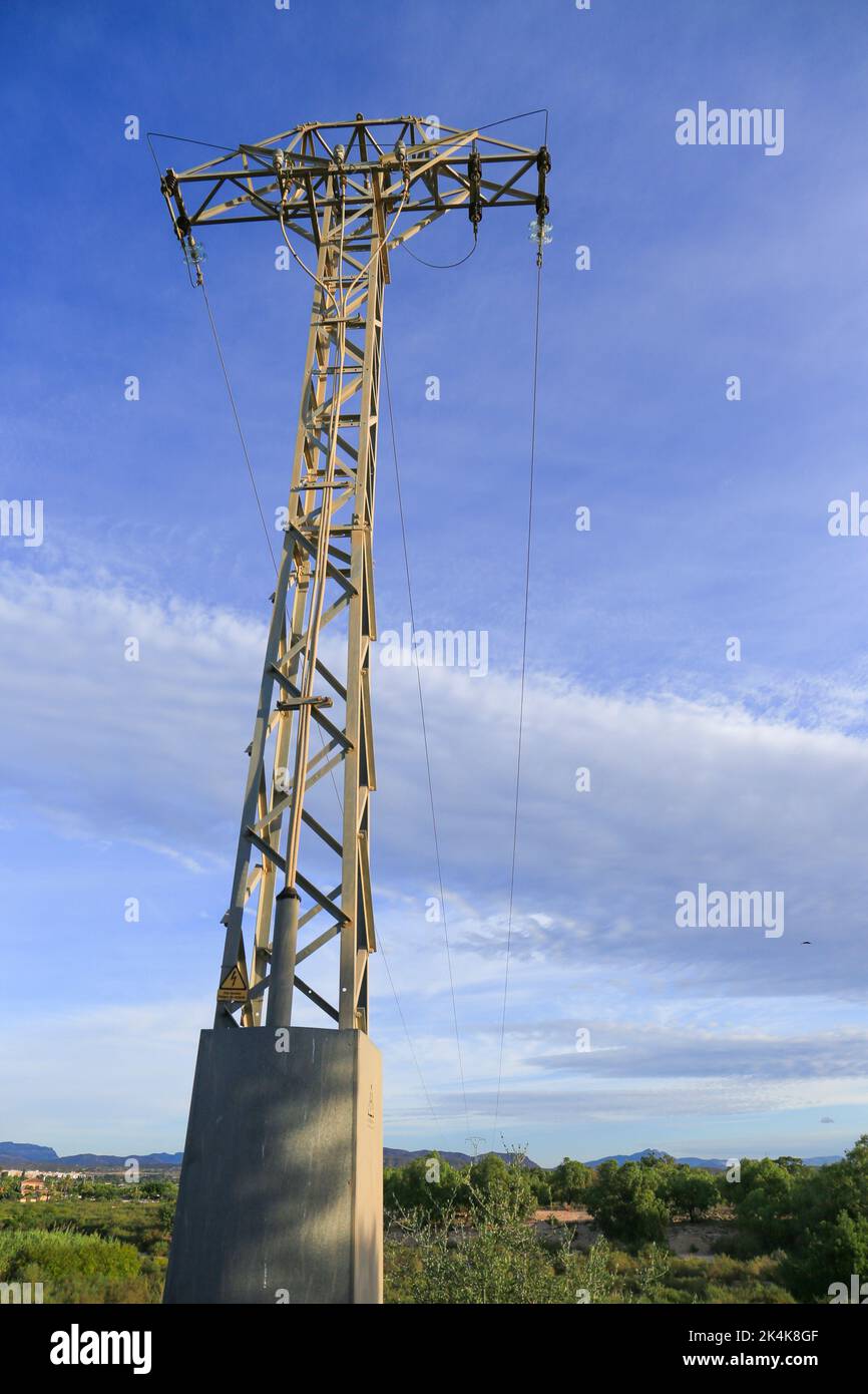Power lines tower under blue sky in the countryside in Spain Stock ...