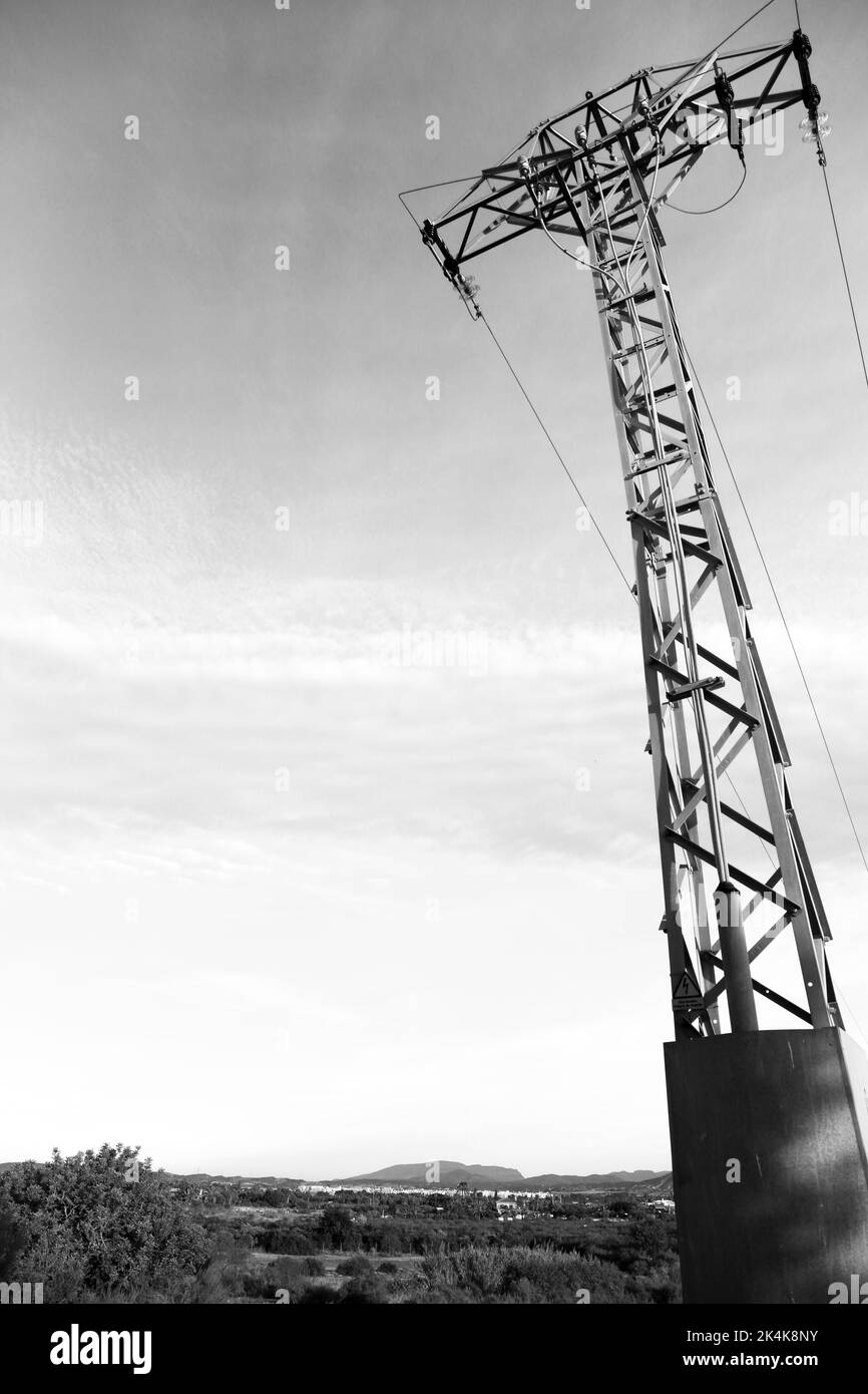 Power lines tower under clear sky in the countryside in Spain Stock ...
