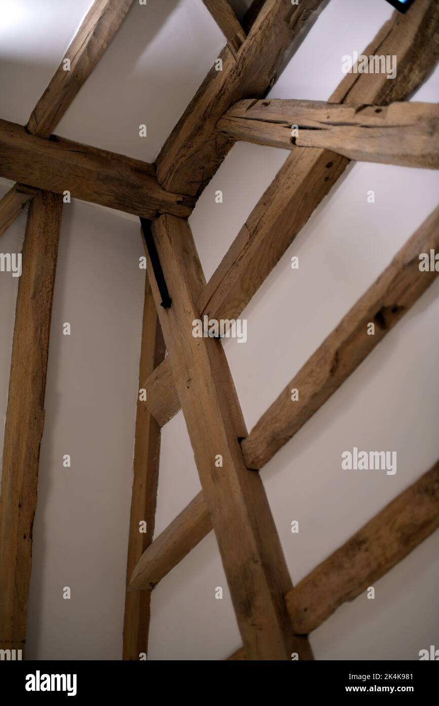 old  refurbished wooden timbers in vintage barn construction Stock Photo