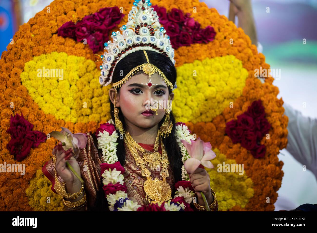 Dhaka, Bangladesh. 03rd Oct, 2022. A kid dressed as living goddess 'Kumari' during the cultural and traditional Kumari Puja at the Ramkrishna Mission in Dhaka. Devotees pray before the living icon of a child Durga for the destruction of evil and the advent of auspicious forces. The Hindu community in Dhaka celebrated Kumari Puja after a two-year break due to the Covid-19 pandemic. Credit: SOPA Images Limited/Alamy Live News Stock Photo