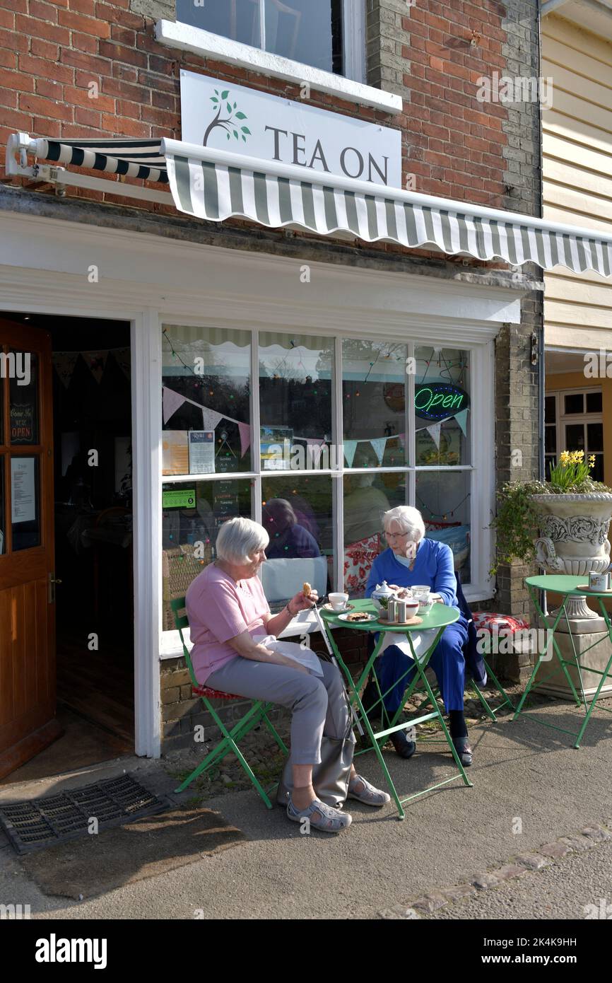 older women sitting outside tearoom cavendish suffolk england Stock Photo