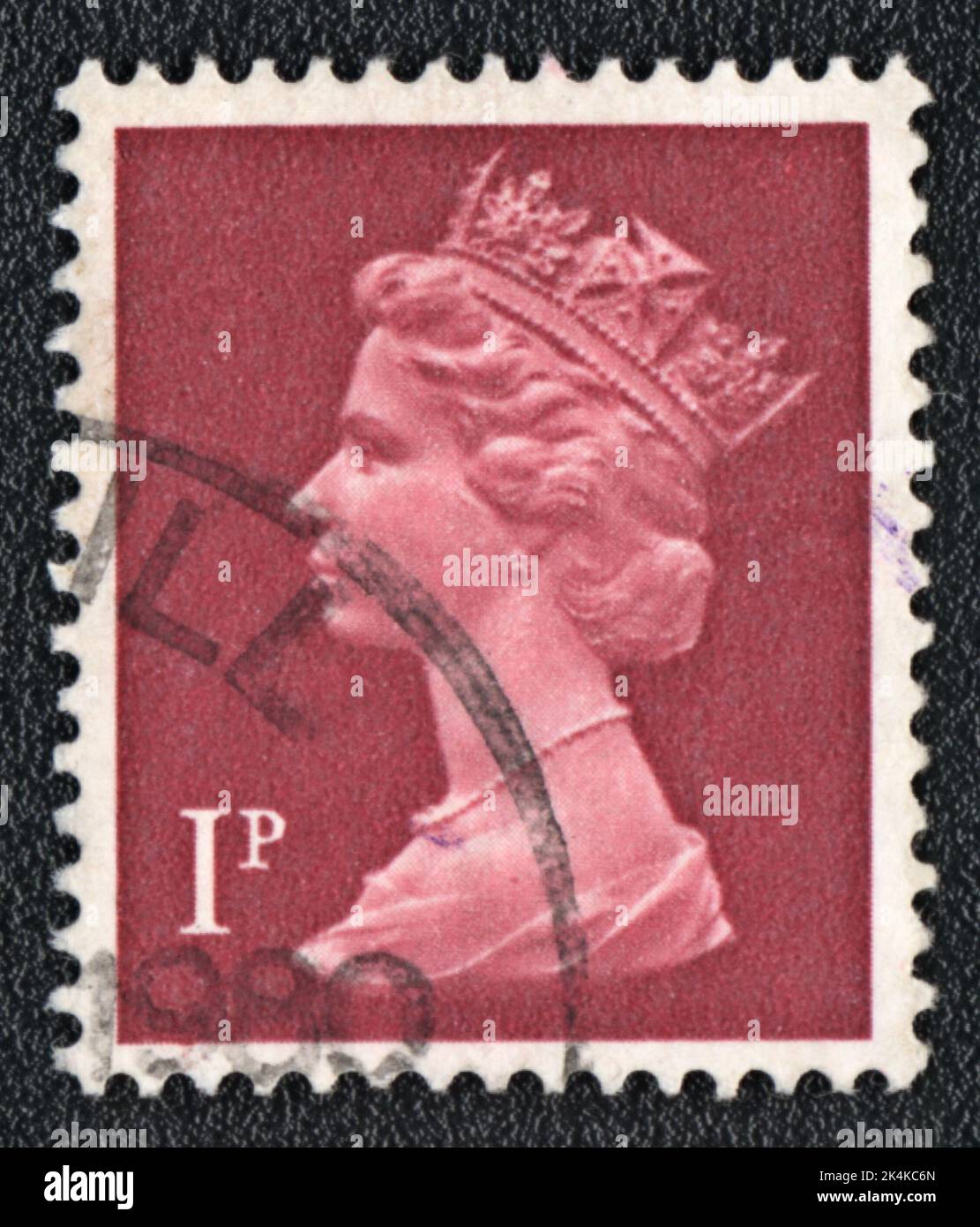 GREAT BRITAIN - CIRCA 1980: stamp printed by Great Britain, shows Portrait of Queen Elizabeth 2nd on red, circa 1980 Stock Photo