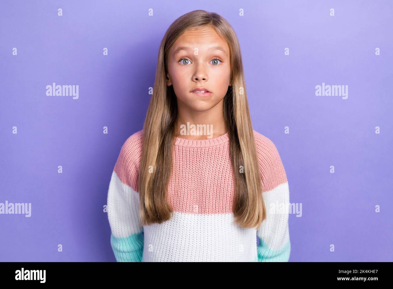 Photo of embarrassed girl dressed trendy pullover impressed news isolated on purple color background Stock Photo