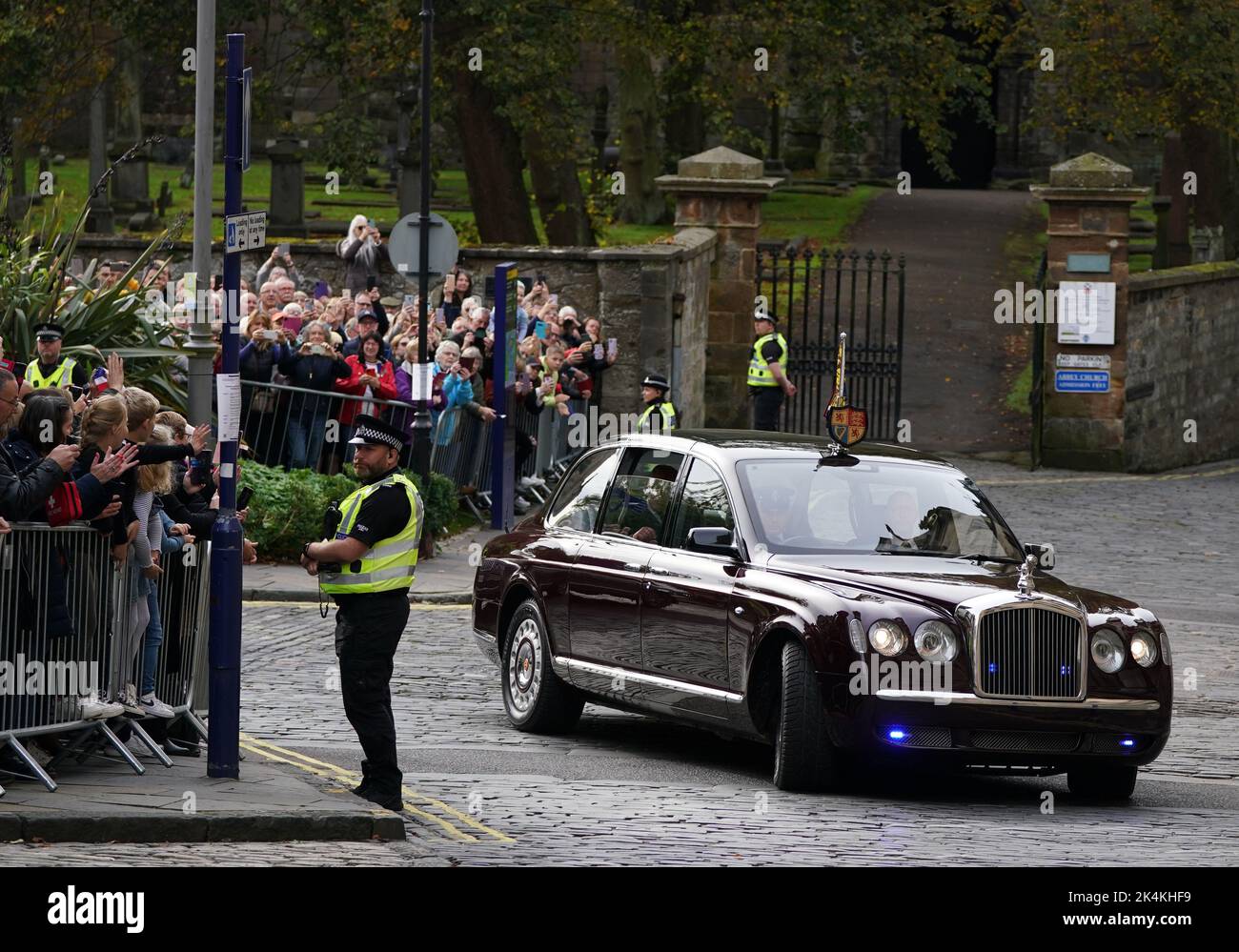 King Charles III and the Queen Consort arrive to attend an official