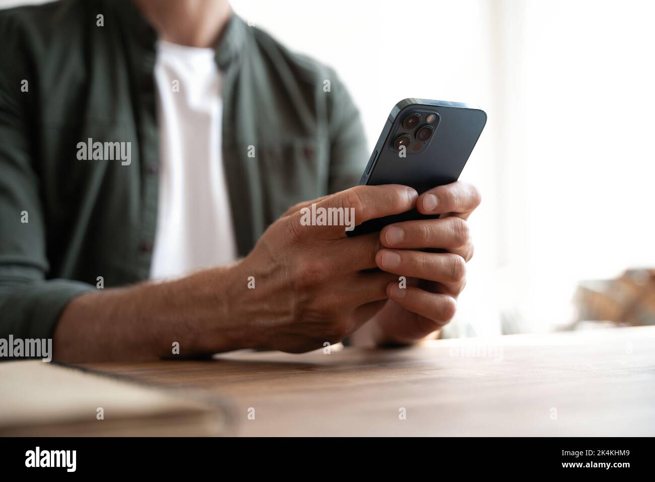 Man pointing on smartphone screen, chatting in social networks, meeting website, searching internet, sending sms, using text messenger or online banki Stock Photo