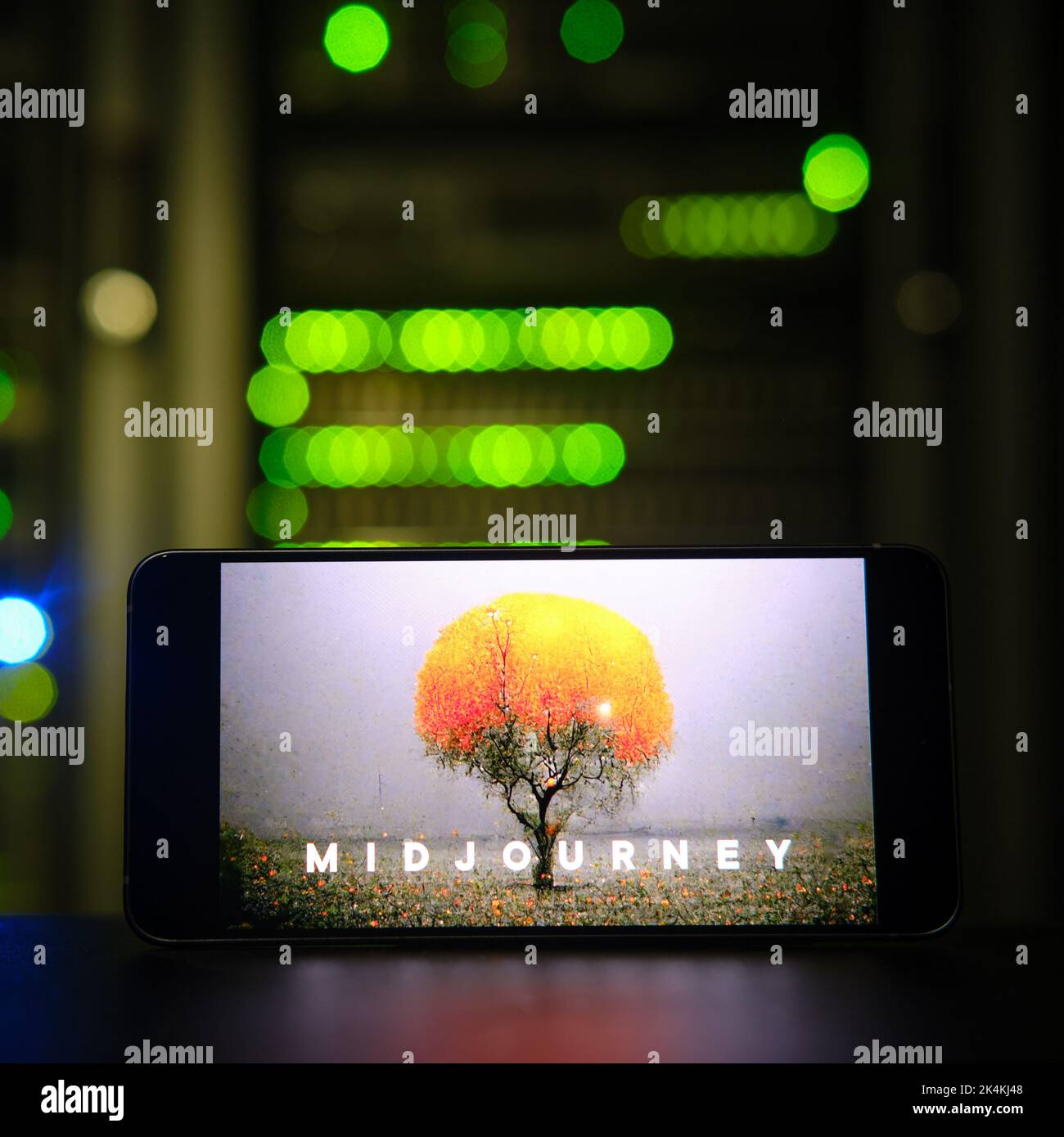 AI Midjourney logo on the phone screen on the background of the server room. Smartphone with artificial intelligence neural network logo - Moscow, Rus Stock Photo
