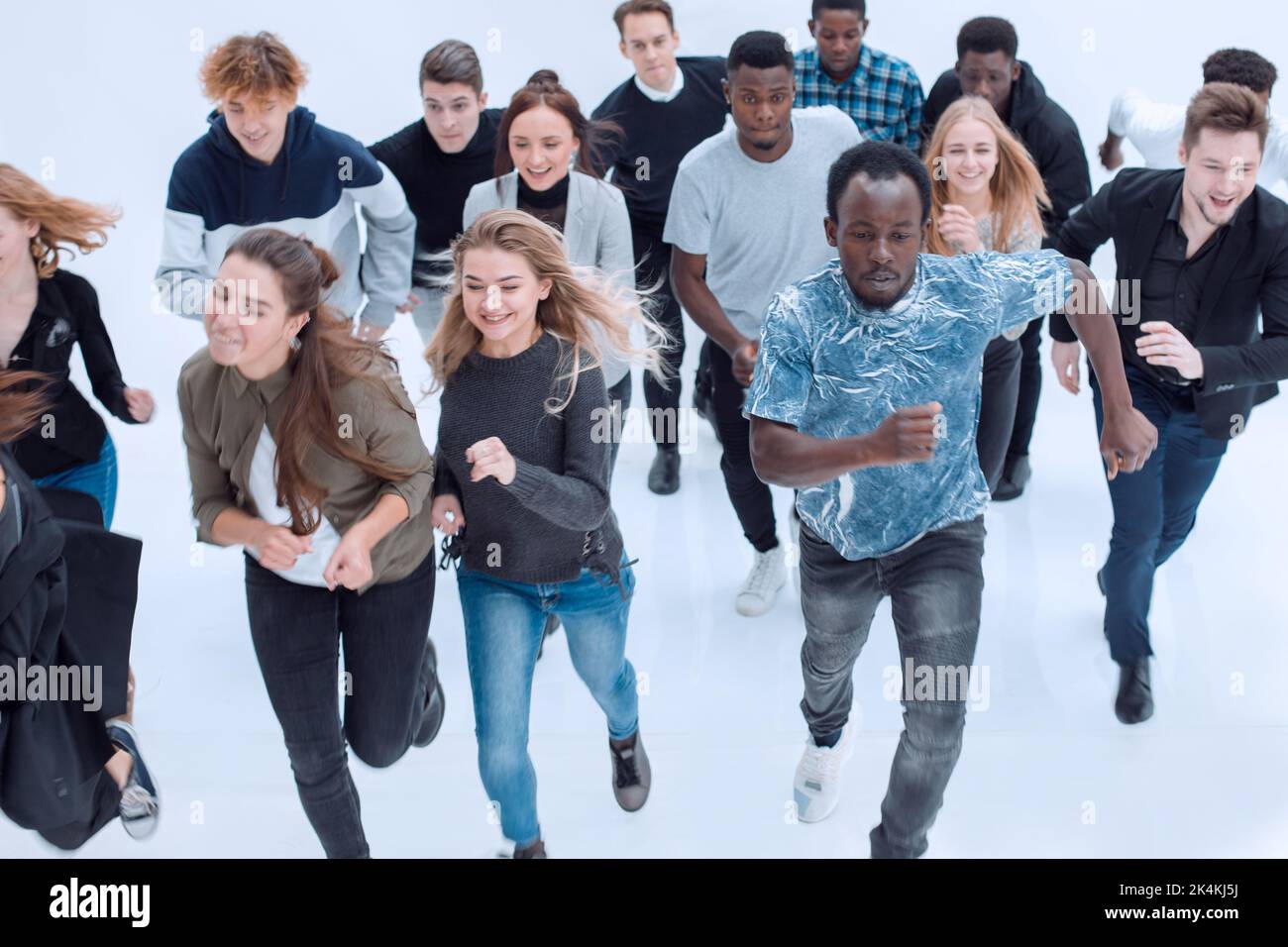 People Springing Forward large group of diverse young people starting forward Stock Photo - Alamy