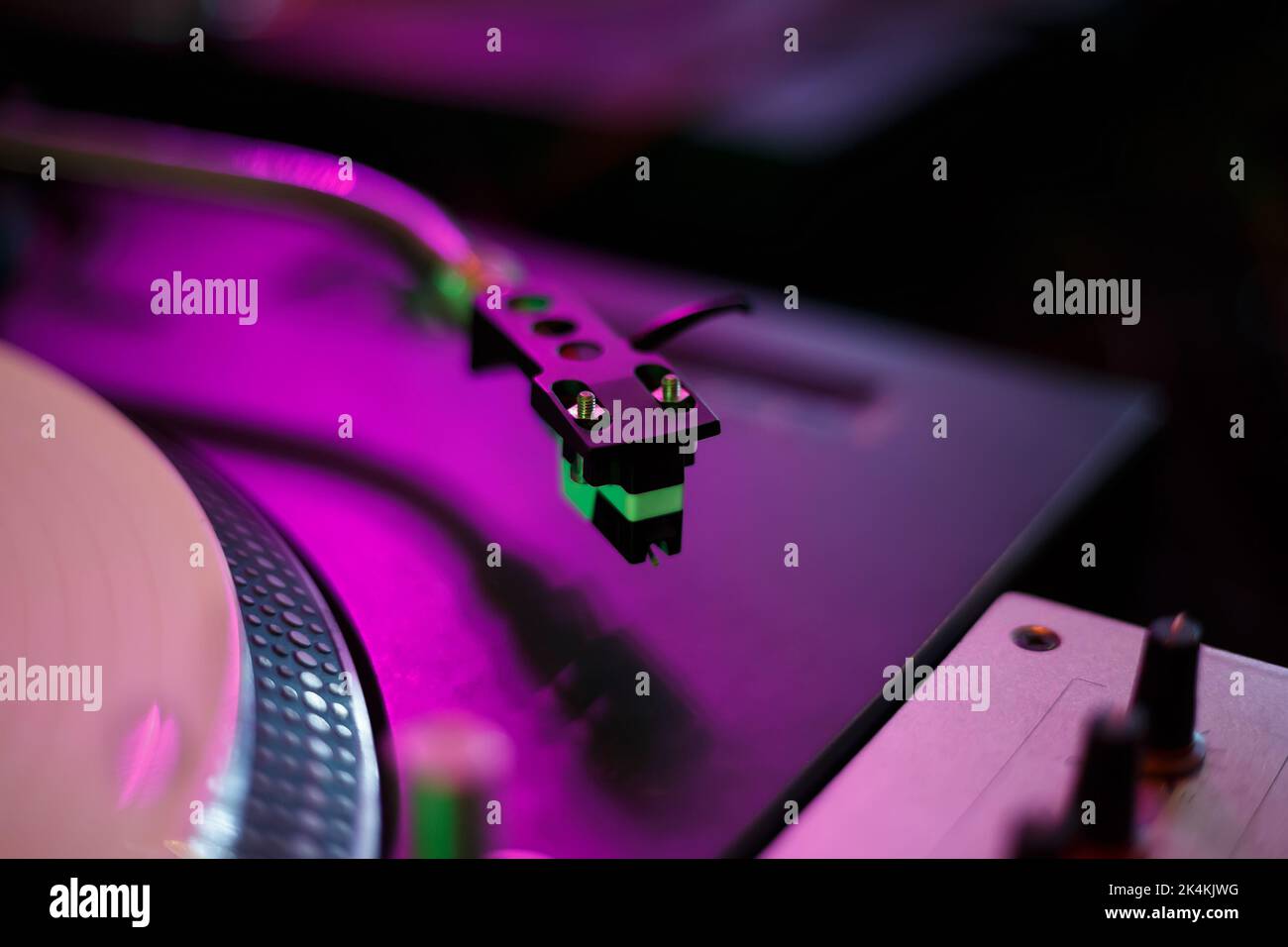 Turntables needle cartridge on vinyl player tone arm. Professional dj