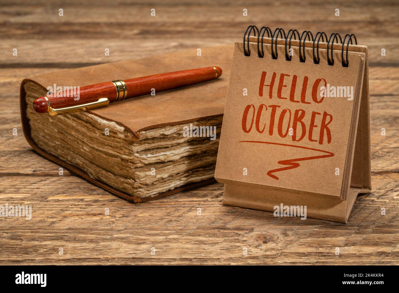 Hello October welcome note - handwriting in a spiral desktop calendar ...