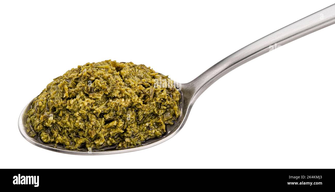 Pesto sauce with basil in spoon isolated on white background Stock Photo