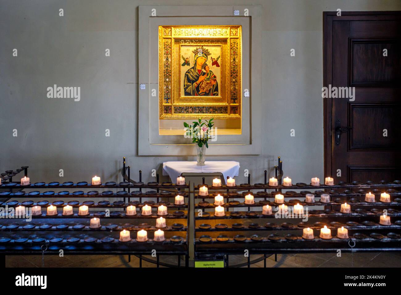 https://c8.alamy.com/comp/2K4KN0Y/peter-and-paul-church-on-bassinplatz-in-potsdam-picture-of-a-saint-behind-the-prayer-candles-2K4KN0Y.jpg