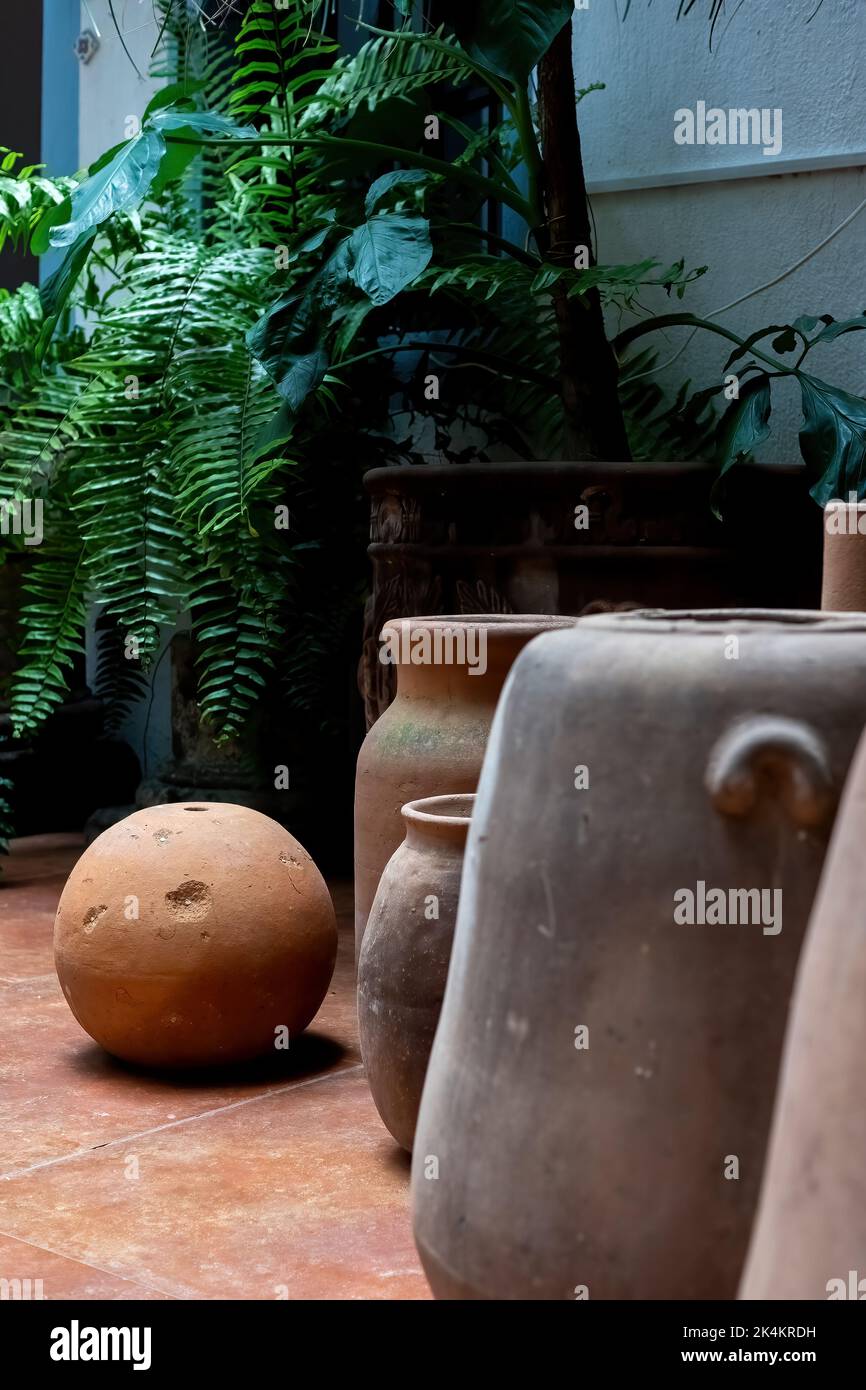 Stacks of various terracotta pots for plants for sale at a garden store