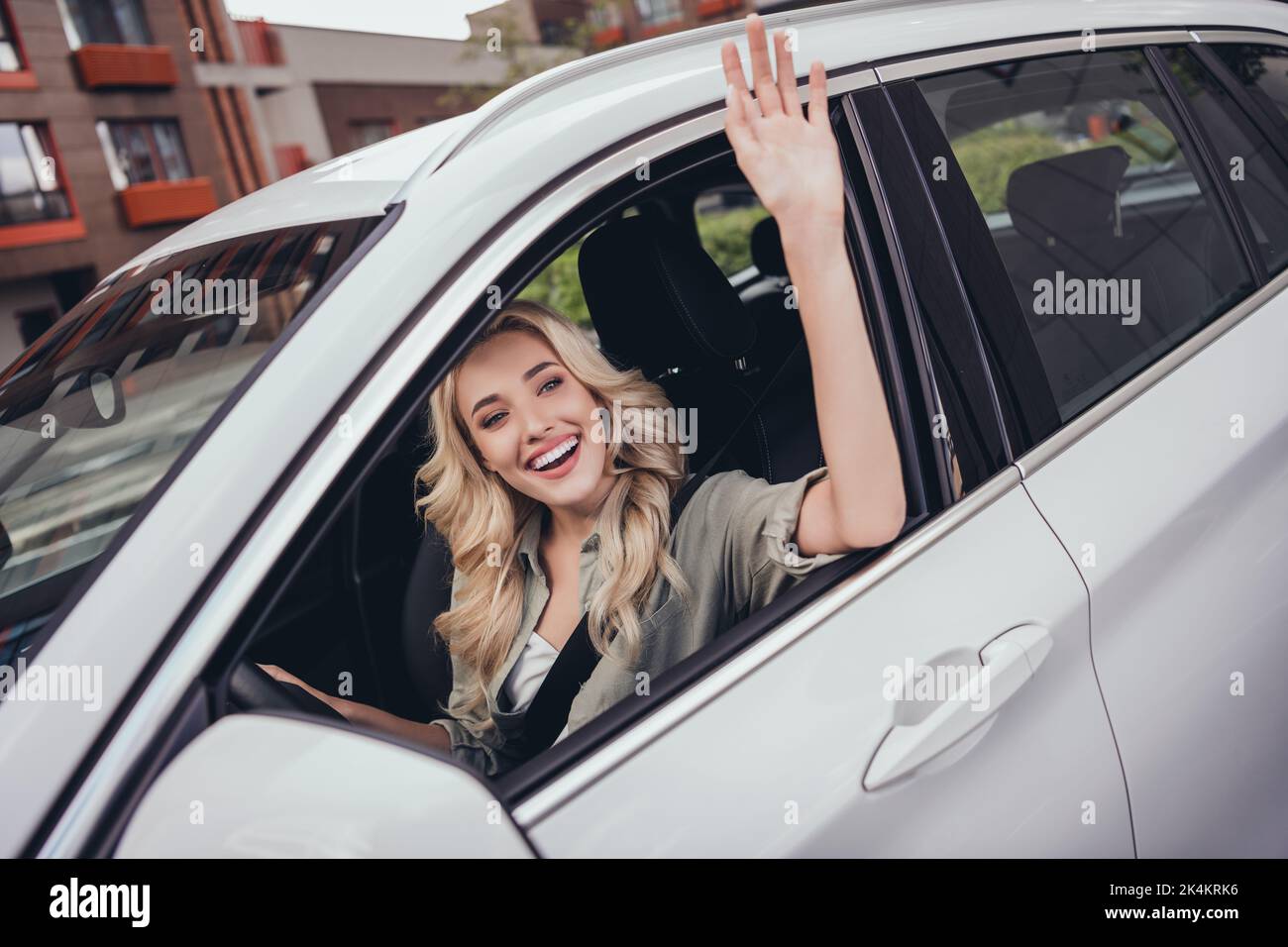 Photo of sweet cute lady plan route trip car rest relax ride show wave