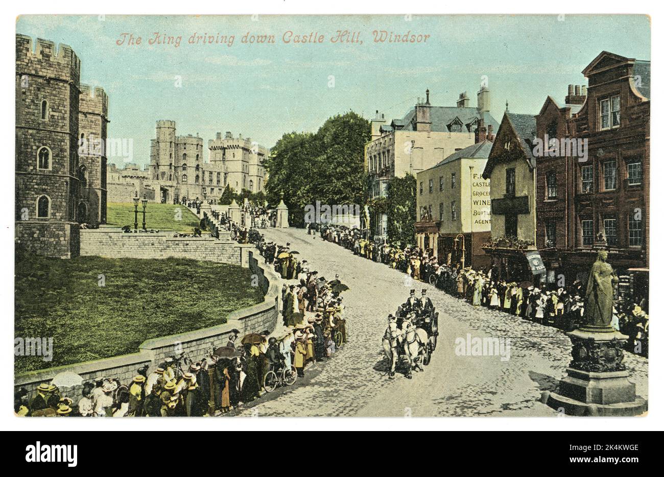 Original Edwardian era tinted colour postcard depicting The King (Edward VII) driving down Castle Hill, Windsor, Berkshire, England. circa 1909, 1910 Stock Photo