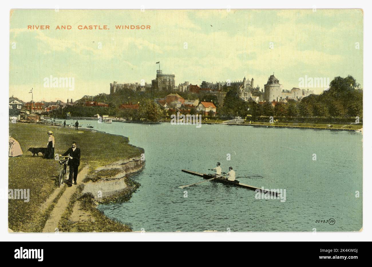 Original Edwardian era tinted colour postcard depicting rowing in front of Windsor castle and river Thames. Windsor, Berkshire, England, UK circa 1910 Stock Photo
