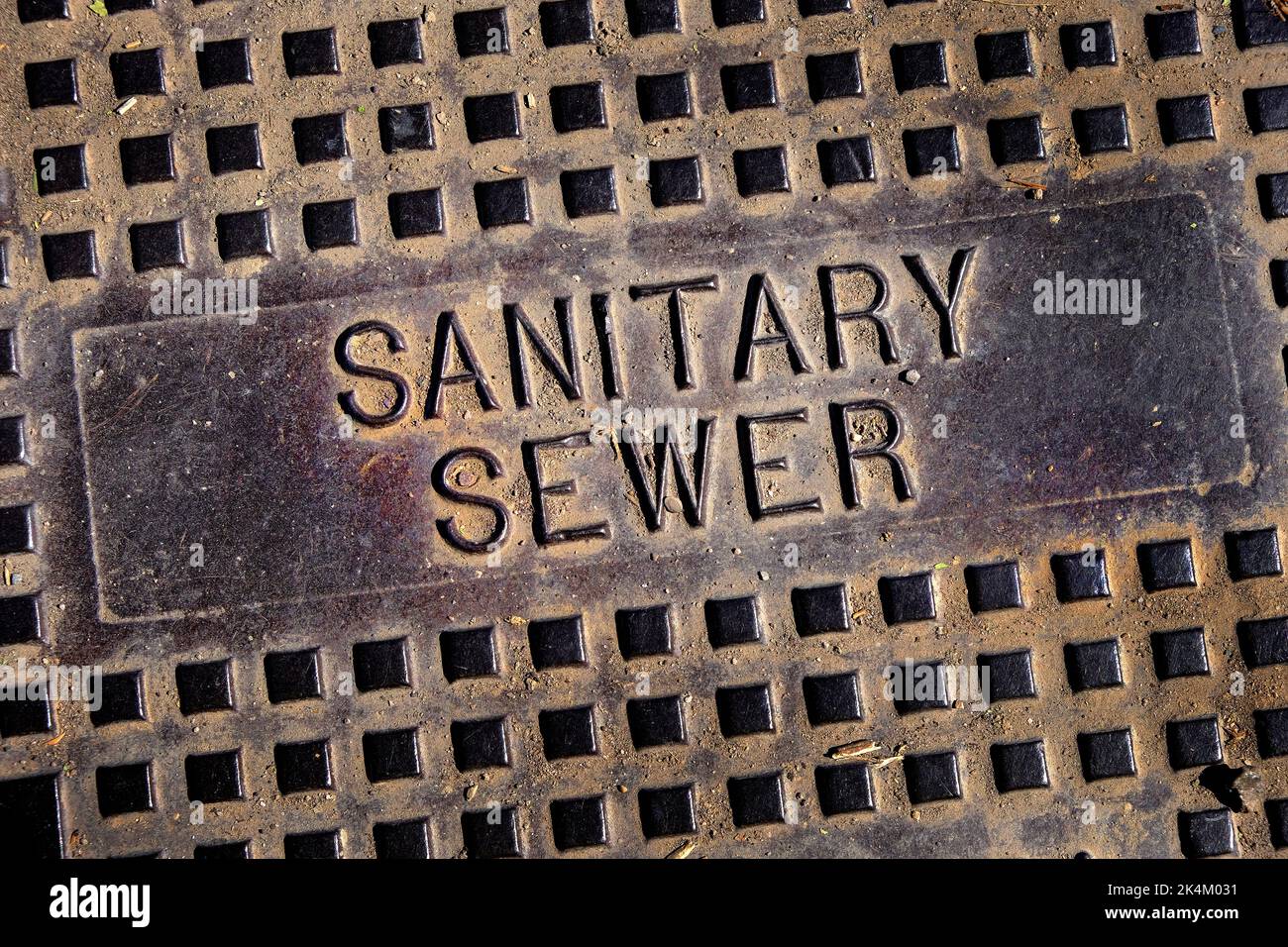 Sanitary sewer man hole cover iron lid with texture and grunge Stock Photo