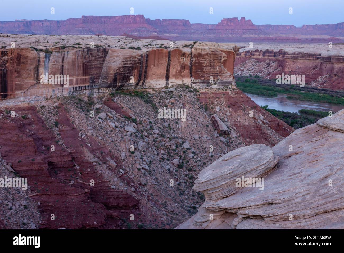 Predawn view across the Green River in Stillwater Canyon from the White Rim Trail in Canyonlands NP, Utah, to the Orange CLiffs & North Point in the G Stock Photo