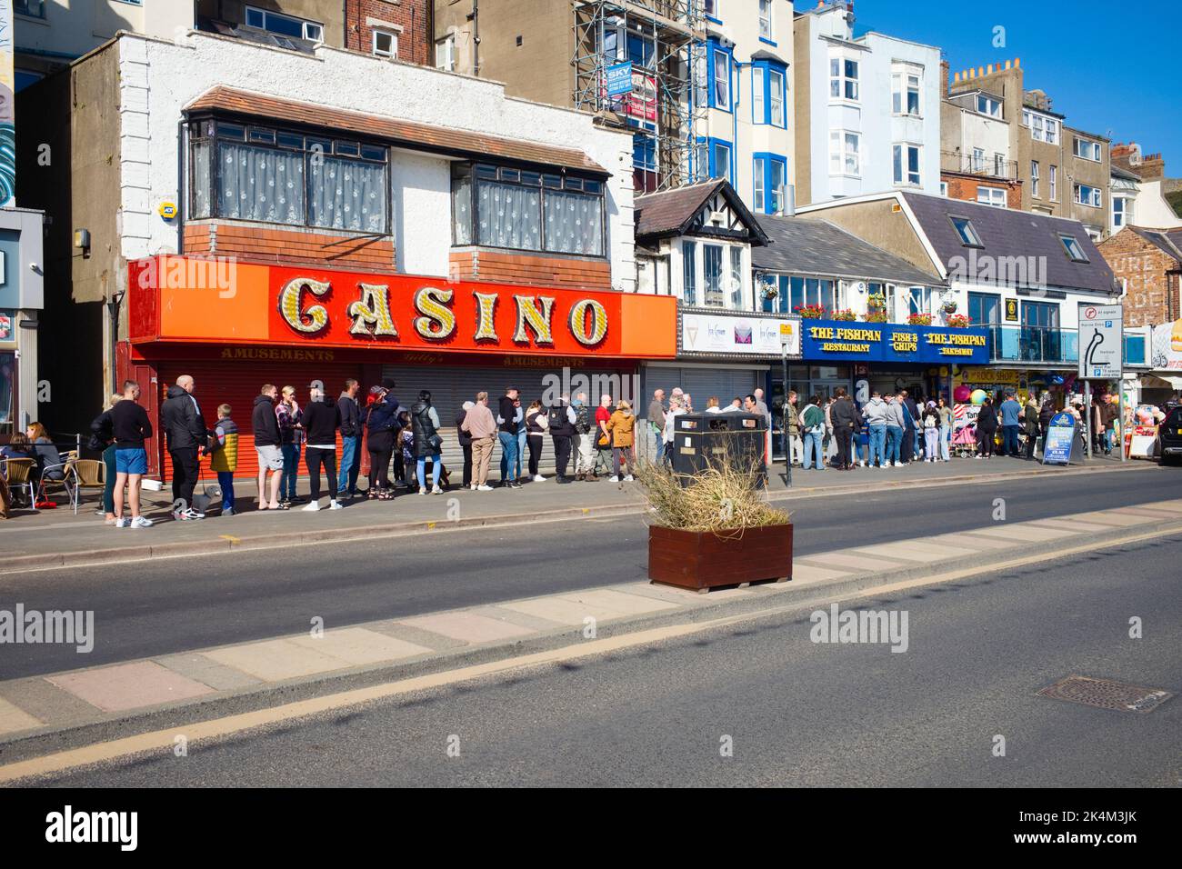 Long queue for fish and chips on the prom at Scarborough on the day of the Queen's funeral Stock Photo