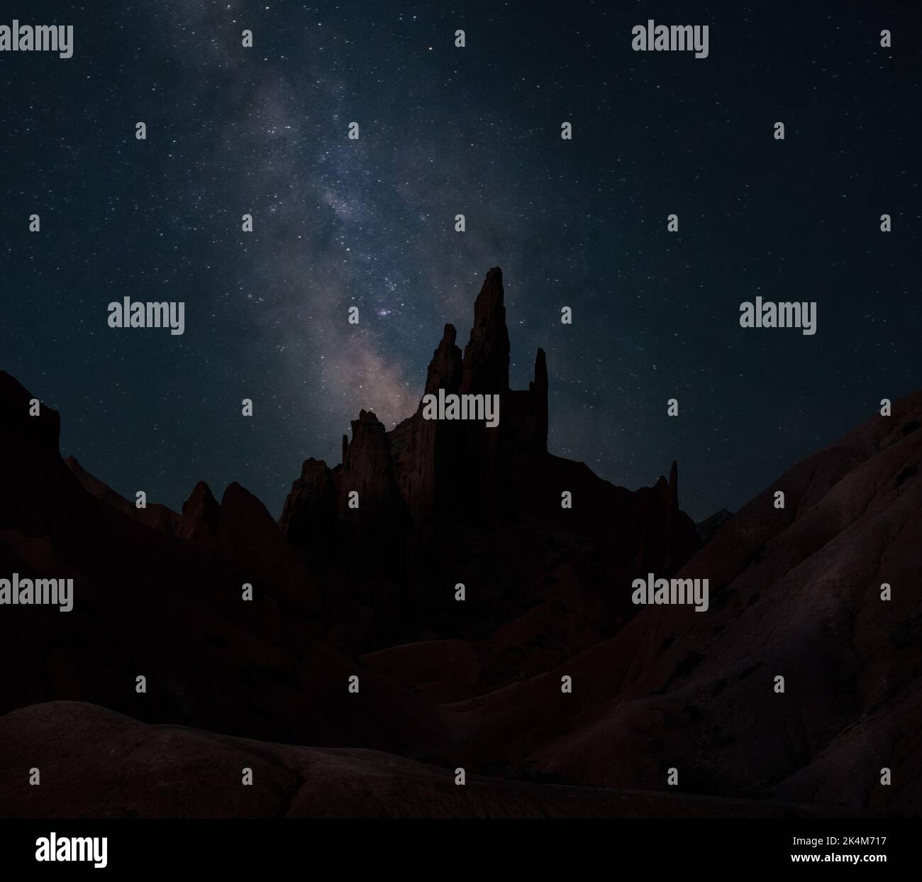 Milky Way above sharp rock formations of Fairytale Skazka Canyon, Kyrgyzstan Stock Photo