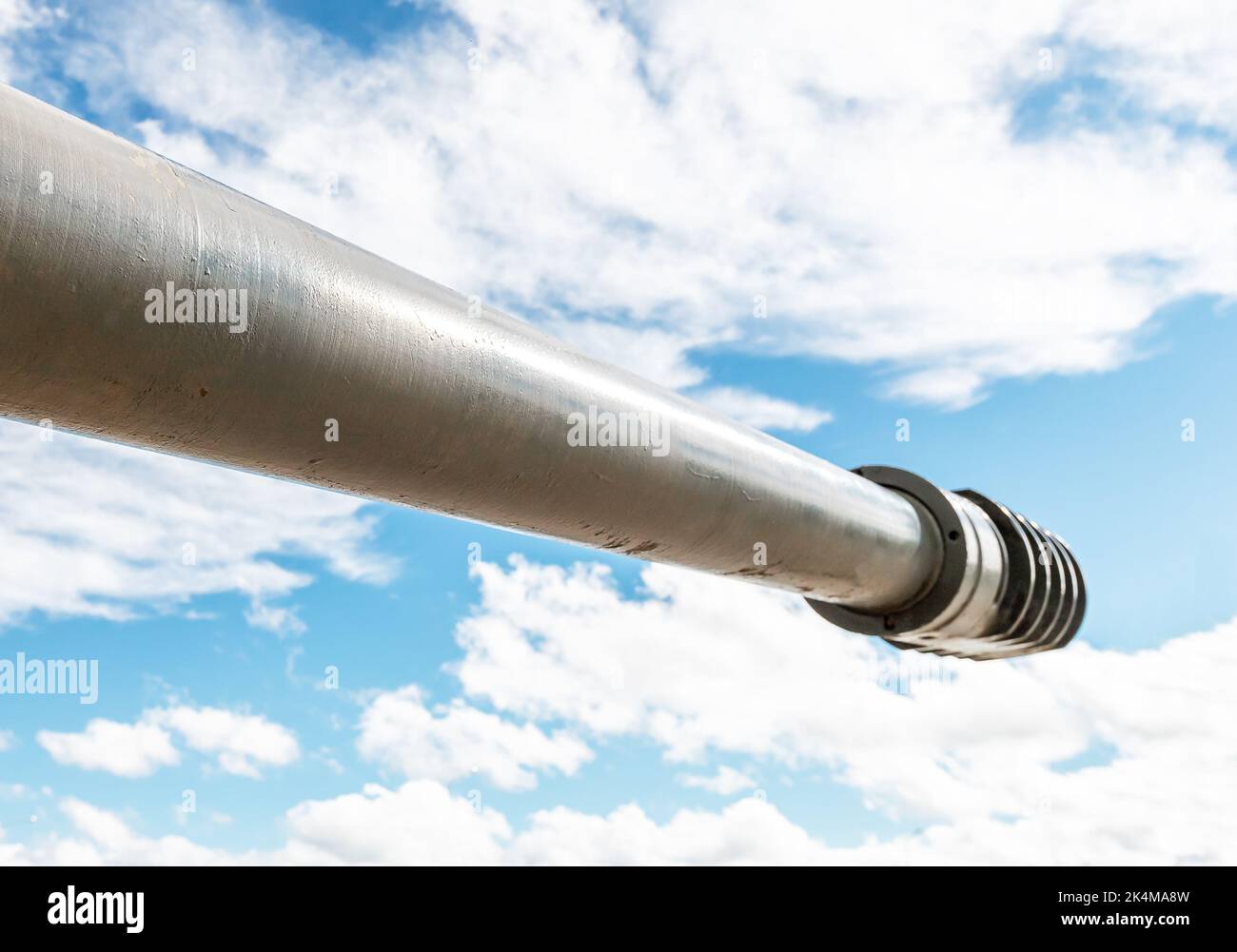 Tank muzzle over cloud sky background. War military concept. High quality photo Stock Photo