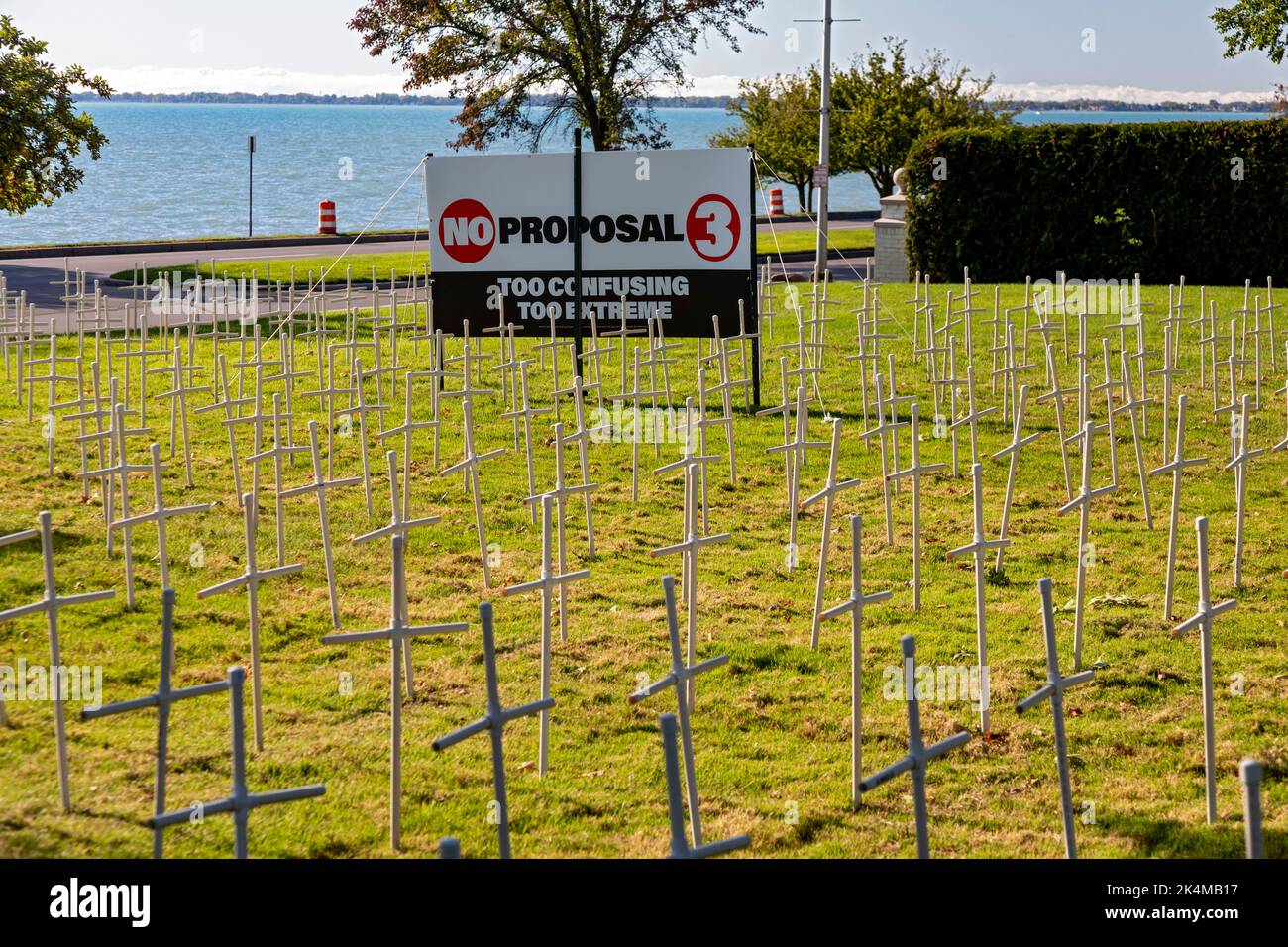 Grosse Pointe Farms, Michigan, USA. 3rd Oct, 2022. As Michigan prepares to vote on Proposal 3, which would enshrine the right to abortion in the state's constitution, St. Paul on the Lake Catholic Church displays dozens of crosses on its lawn, with signs opposing the measure. The display has become controversial; city resident Edsel Ford II said it 'diminish[es] the character of our neighborhood.' Credit: Jim West/Alamy Live News Stock Photo