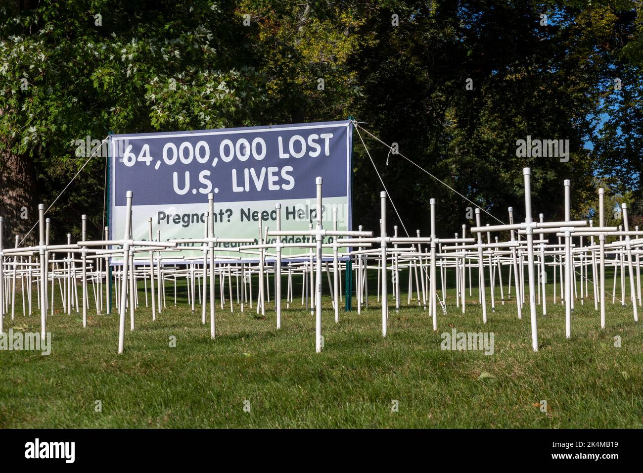 Grosse Pointe Farms, Michigan, USA. 3rd Oct, 2022. As Michigan prepares to vote on Proposal 3, which would enshrine the right to abortion in the state's constitution, St. Paul on the Lake Catholic Church displays dozens of crosses on its lawn, with signs opposing the measure. The display has become controversial; city resident Edsel Ford II said it 'diminish[es] the character of our neighborhood.' Credit: Jim West/Alamy Live News Stock Photo