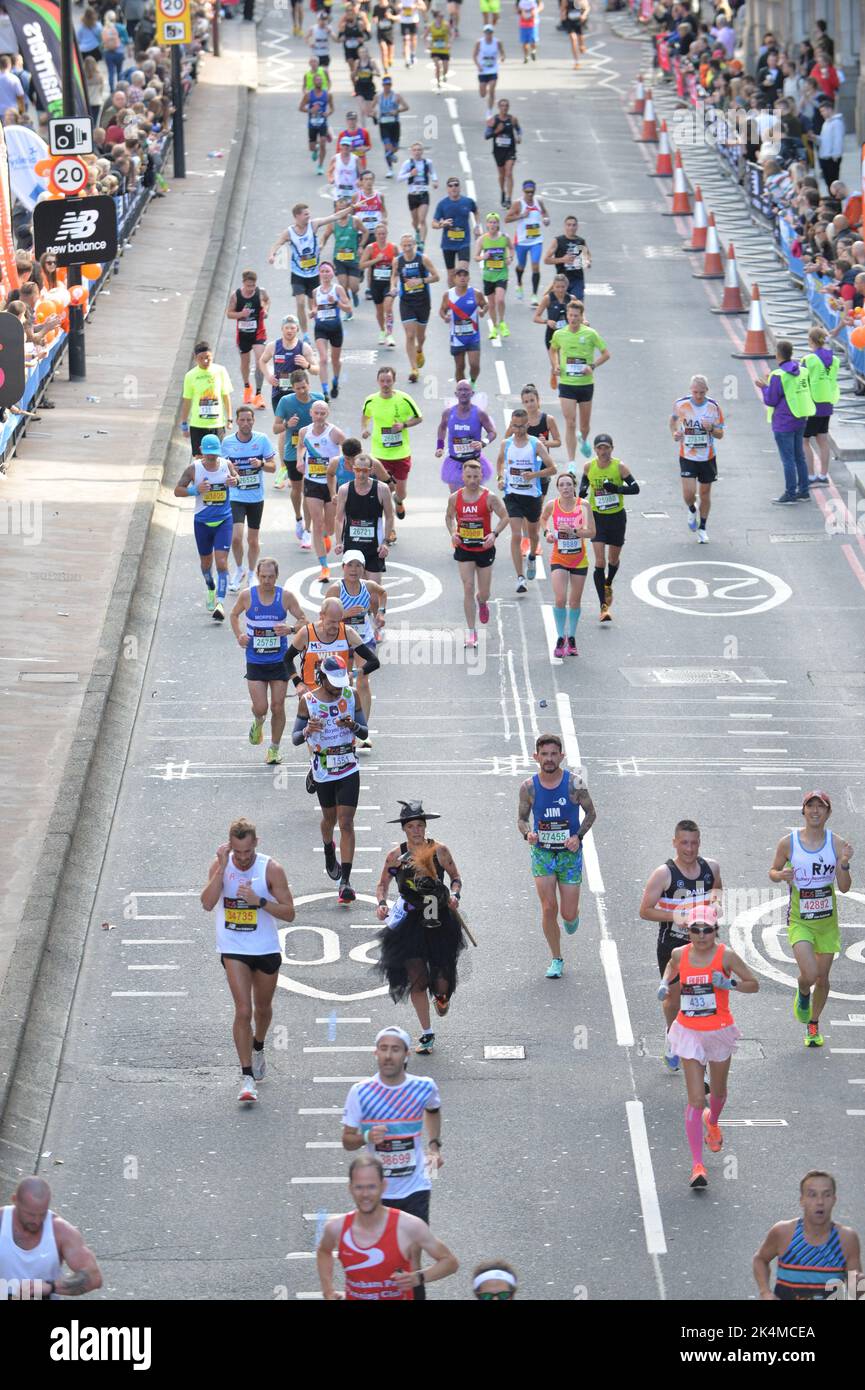 Large group of runners competing in the 2022 London marathon. Stock Photo