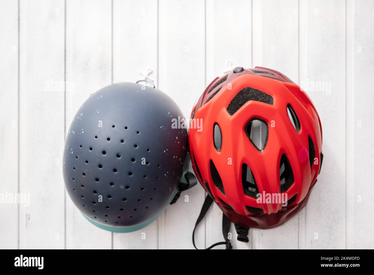 choice between two helmets, for riding and for cycling for the child Stock Photo