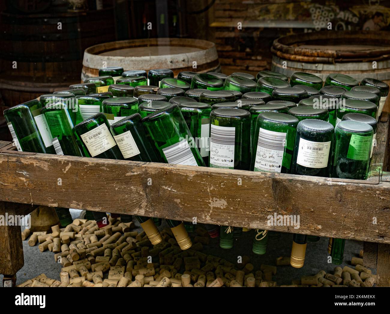 Inverted empty wine bottles with corks Stock Photo