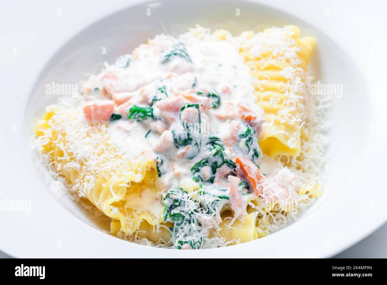 pasta with creamy salmon sauce with spinach Stock Photo - Alamy