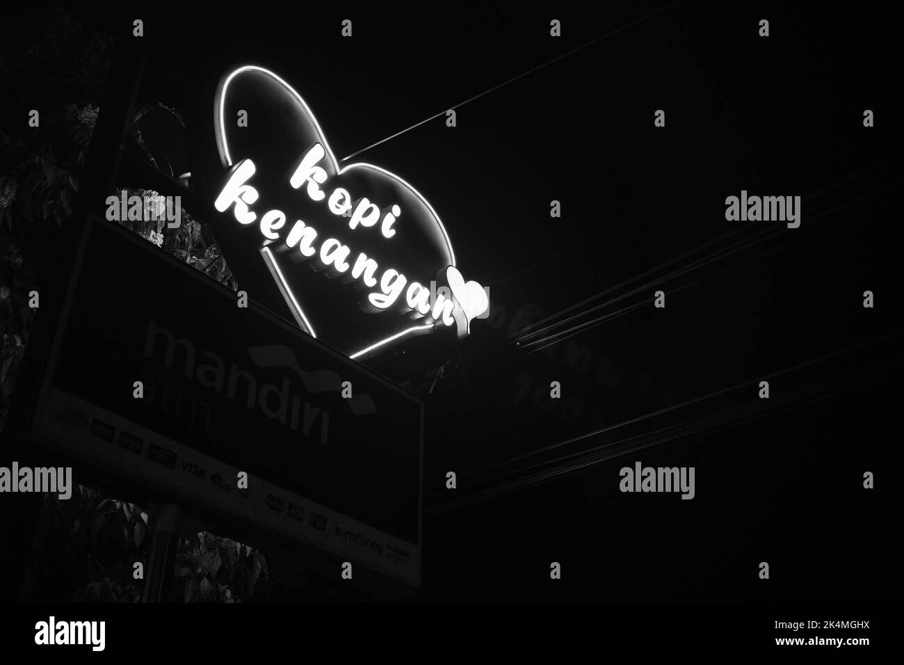 Cicalengka, West Java, Indonesia - 27 September, 2022 : Monochrome photo of neon lights from the drink brand sign 'Kopi Kenangan' Stock Photo