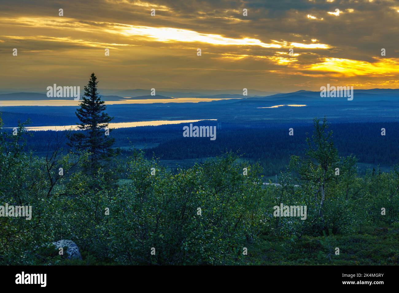 Vew from mount Sörstubba over Laponia world heritage and the Mountains of Sarek nationalpark in background at sundown, Swedish Lapland, Sweden. Stock Photo